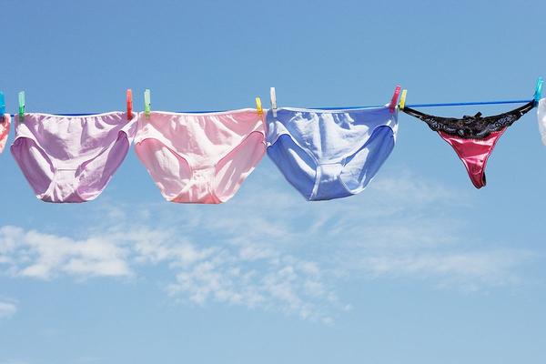 Why should you avoid black or dark underwear?