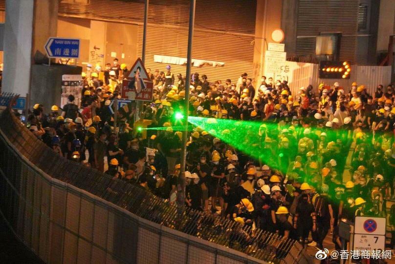 In Hong Kong, protesters draw lasers to blur cameras