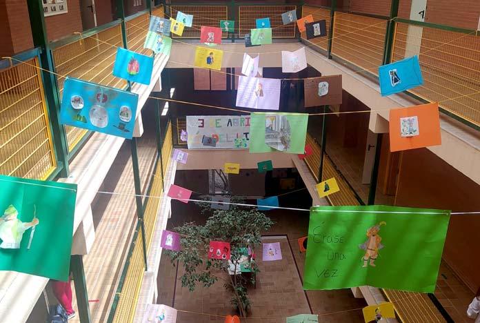 The IES Torre de los Herberos decorates the center with a book a tile