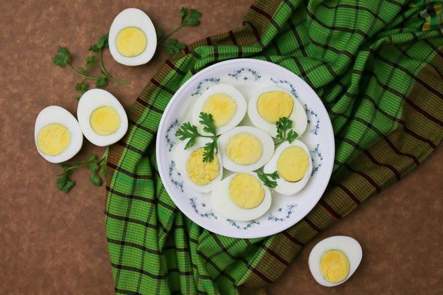 Why do hard-boiled eggs have a weird green ring around the yolk?