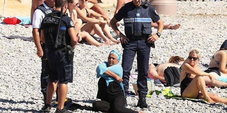 Photos of a woman in a burkini checked by the Nice police are controversial