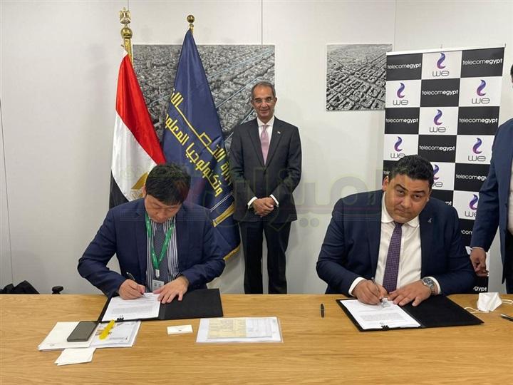 Talaat is witnessing the signing of an agreement between Telecom Egypt and Huawei International