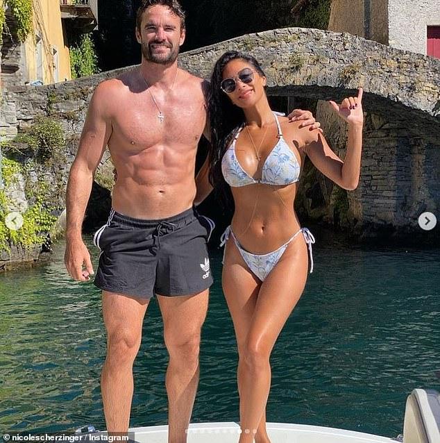 Nicole Scherzinger shows off toned abs on romantic getaway with Thom Evans 