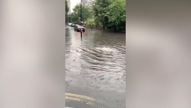 Families stranded and stations underwater as flash floods batter London