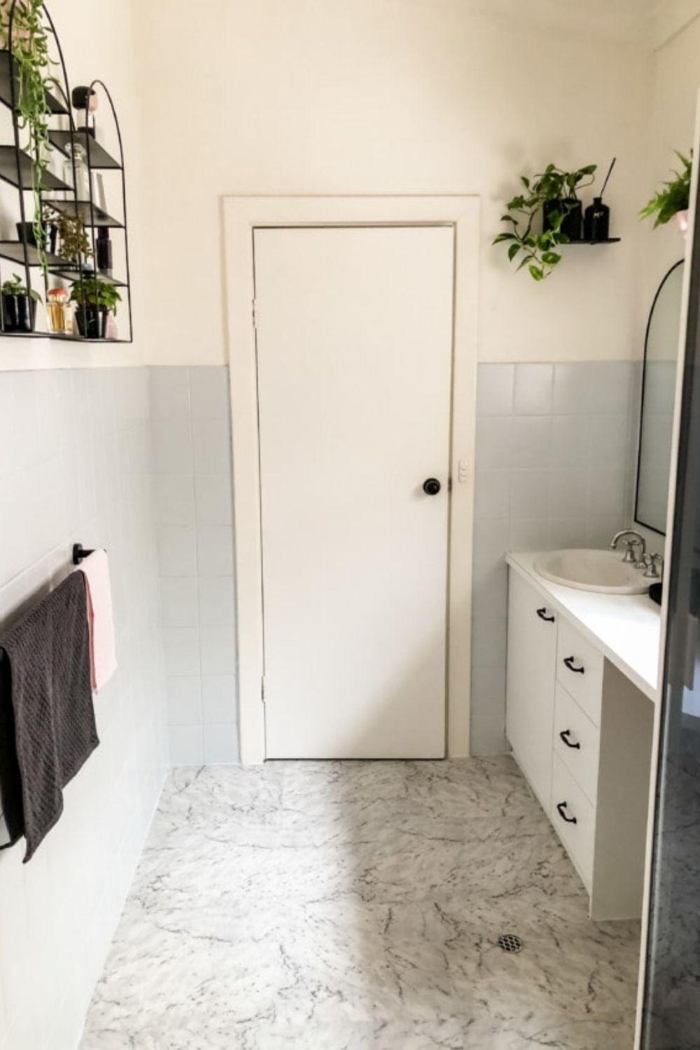 This stunning bathroom makeover cost only 0 using self-stick vinyl floor tiles 