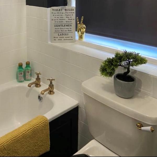 DIY mum transforms bathroom with Amazon stick-on tiles and saves £3500 