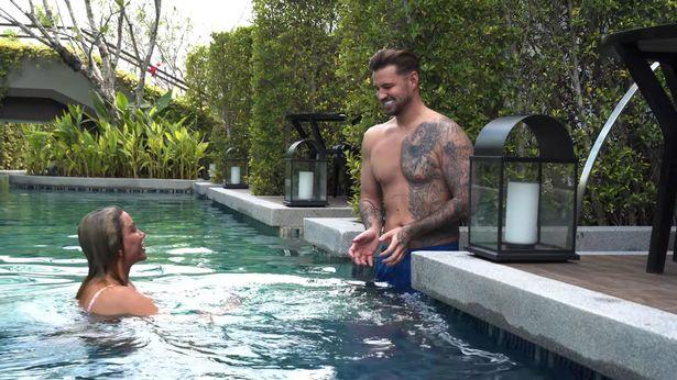 Carl Woods pops Katie Price's spots for her as they relax in pool on Thailand getaway 