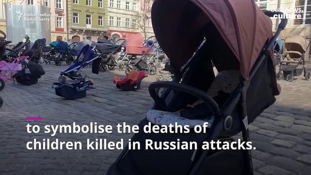 109 empty prams placed in square to mark each child slaughtered by Putin's forces 