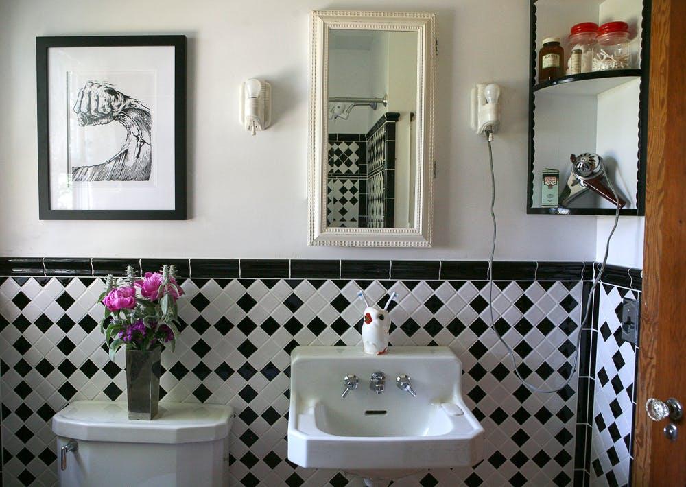 This 'Genius' Sink Topper Instantly Increases Counter Space in Small Bathrooms — and It's Under  