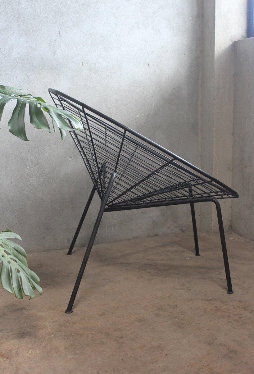 this minimal black iron chair is inspired by spiders 