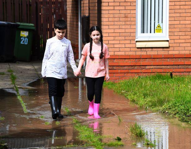 Fuming mum says kids need wellies to leave house as sinkhole keeps garden flooded