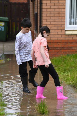 Fuming mum says kids need wellies to leave house as sinkhole keeps garden flooded 