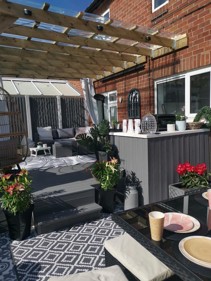 DIY couple turn 'awful' decking into 'stunning' pergola using B&M and Dunelm bargains 