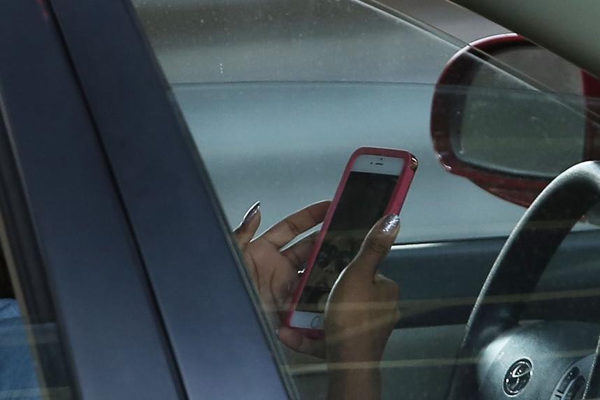 Any use of hand-held mobile phone while driving to become illegal 