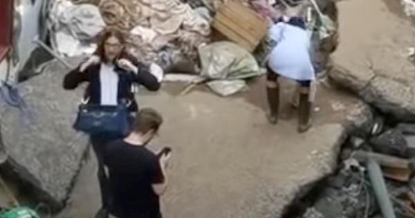 TV journalist suspended after 'rubbing mud on her face' in flood clean-up report