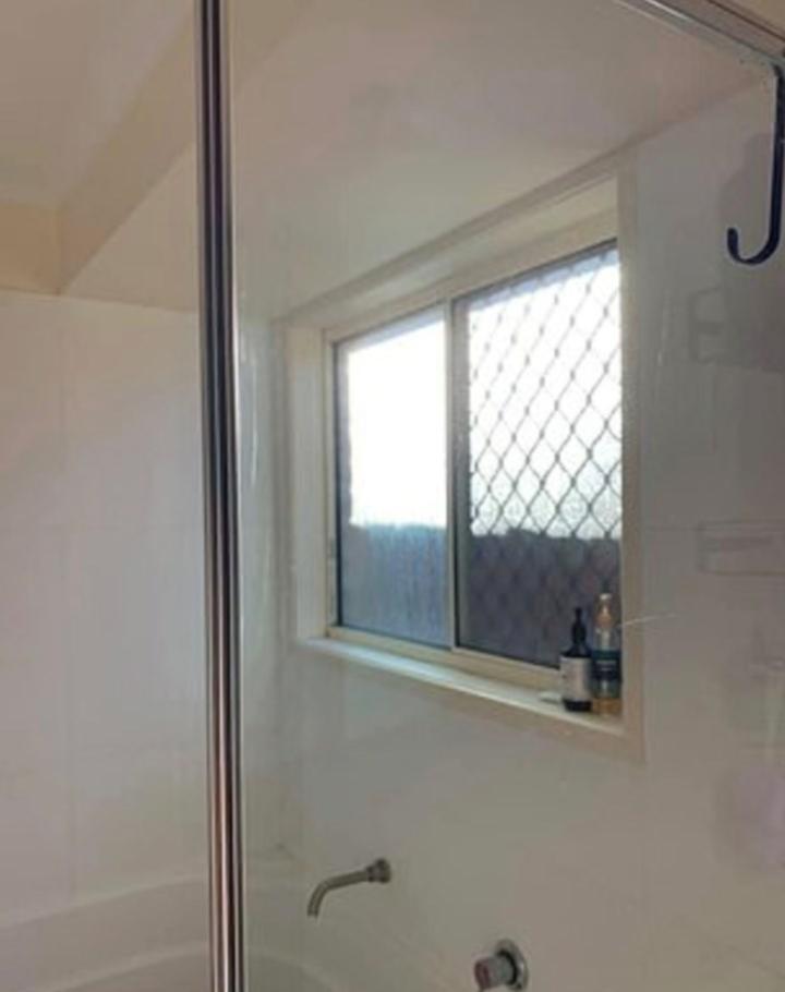 Woolworths shopper’s miracle shower screen transformation - using two bargain buys 