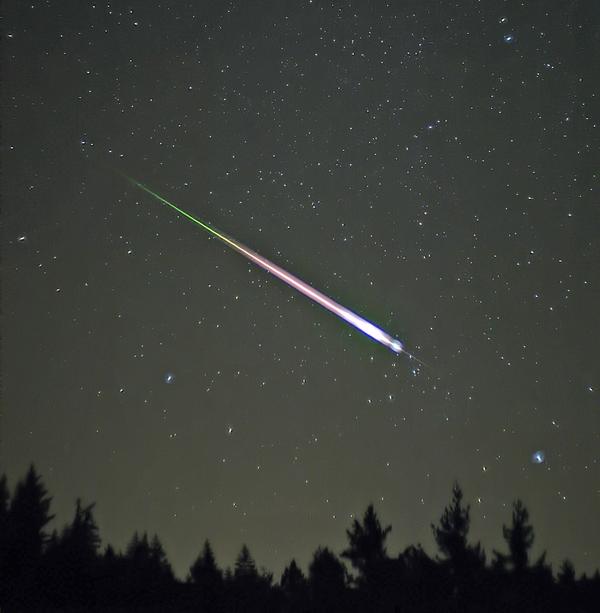 Falling object lights up the night sky 