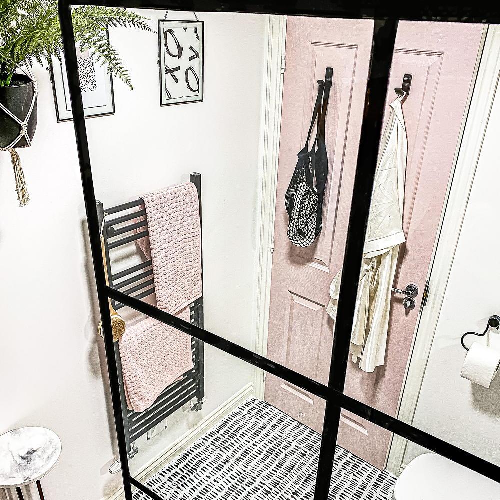 Clever DIYer shows how to create a Crittall-effect shower door – for just £2! 