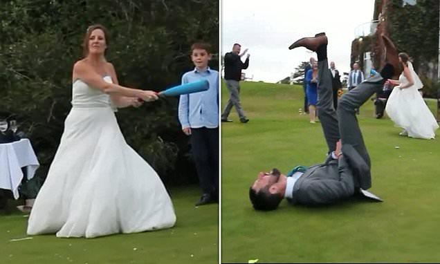 Bride playing a game of rounders at her wedding smacks a ball into her new husband's groin 