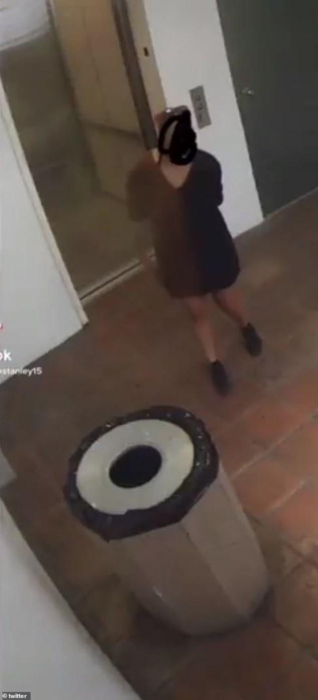 Vile moment security footage captures DoorDash delivery driver using lobby trash can as a toilet