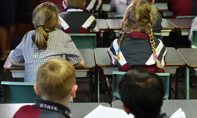 Teacher accused of dragging a primary school pupil along the floor says she felt 'ashamed'