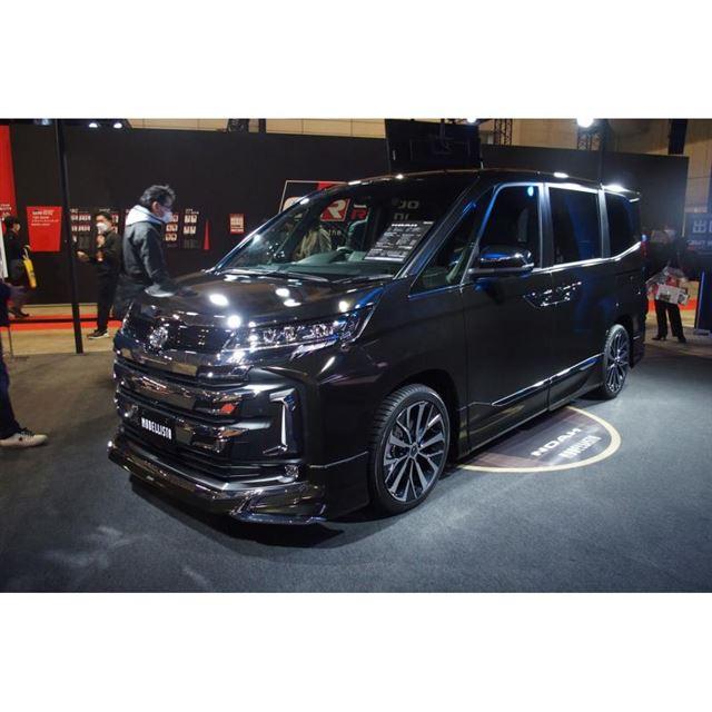 A new Noah / Voxy actual car customized with Modelista parts is shown at an auto salon