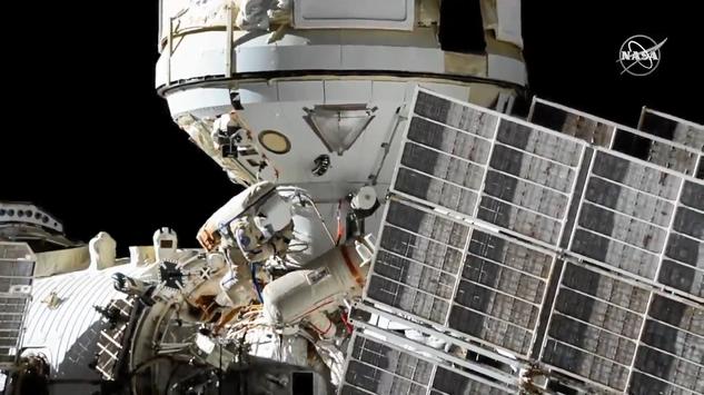 Russian spacewalkers connect new lab module to station power system