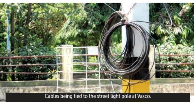 Bundles of TV Cables Hanging from Electric Poles Pose Danger to Pedestrians