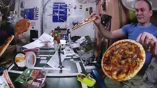 Watch..astronauts eat slices of "floating pizza" in the absence of gravity in space