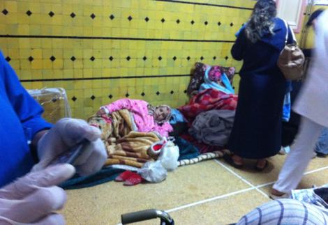 Women and their newborns sleep on the ground in the center of Kokar Hospital in Fez