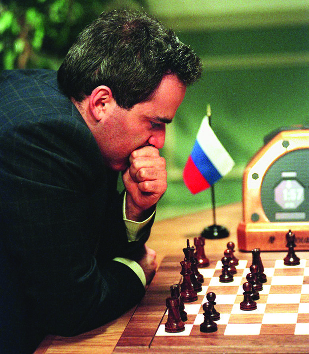 The chess game that thrust AI into the spotlight In this file photo taken on May 11, 1997 Chess enthusiasts watch World Chess champion Garry Kasparov on a television monitor as he holds his head in his hands at the start of the sixth and final match May 1 