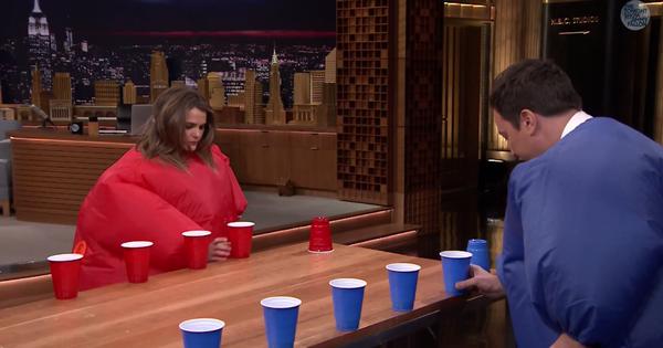 Watch Keri Russell Crush Jimmy Fallon at Flip Cup While Wearing Giant Inflatable Suits 